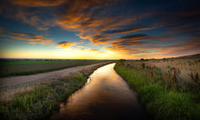 Load image into Gallery viewer, Water flows in the Bessemer Ditch near Vineland on June 23. Pueblo Water acquired rights to one-third of the ditch, but has been working with local farmers to help ensure their farmland remains productive (Mike Sweeney, Special to The Colorado Sun)